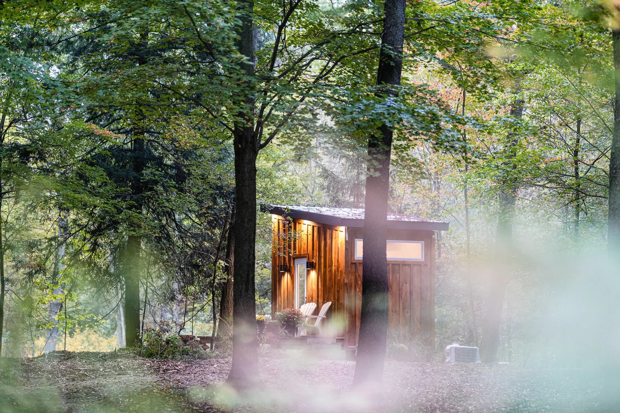 Couple by the fire pit at Fernwood Hills — romantic getaway near London, Ontario