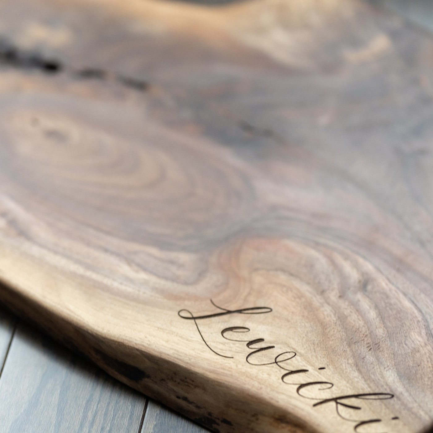Close detail of custom engraved cutting board lettering