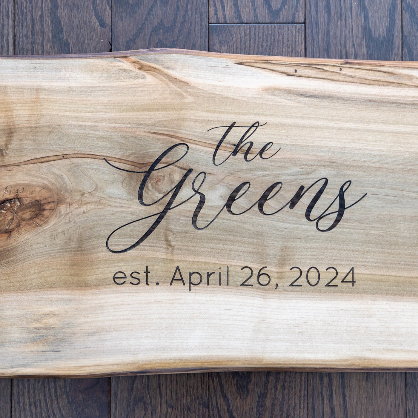 Live edge wedding guest book board with engraved names and date