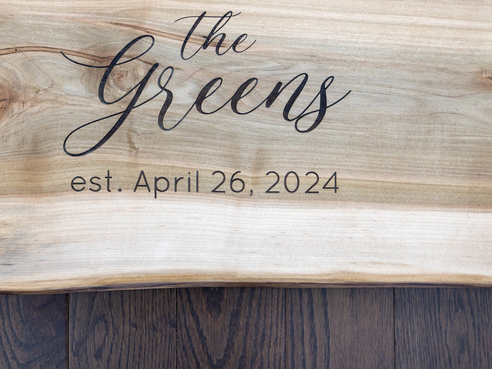 Open signing surface on a live edge wedding guest book board